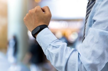 isolated business man with smart wristband